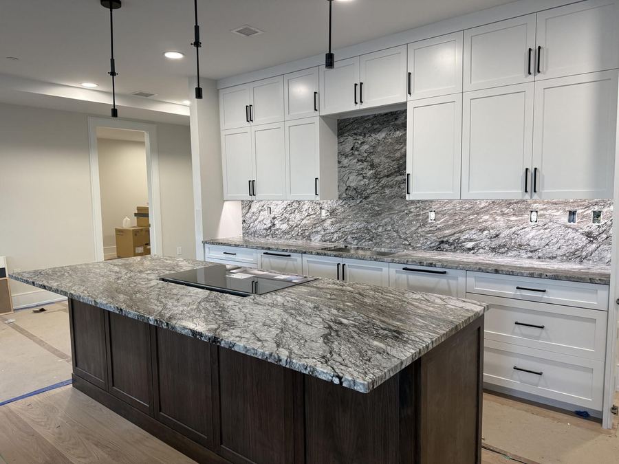 Close-up of a finished granite countertop installation with natural veining